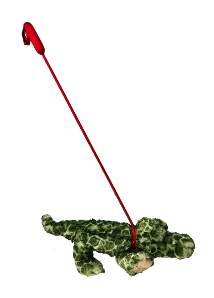 plush alligator toy on a red leash