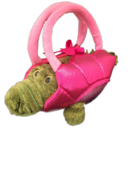 plush alligator toy in pink basket holder